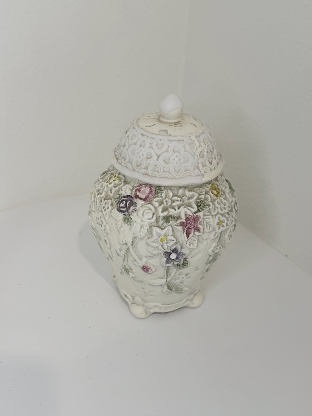 White Floral Embossed Ceramic Decorative Jar with Hand-Painted Accents